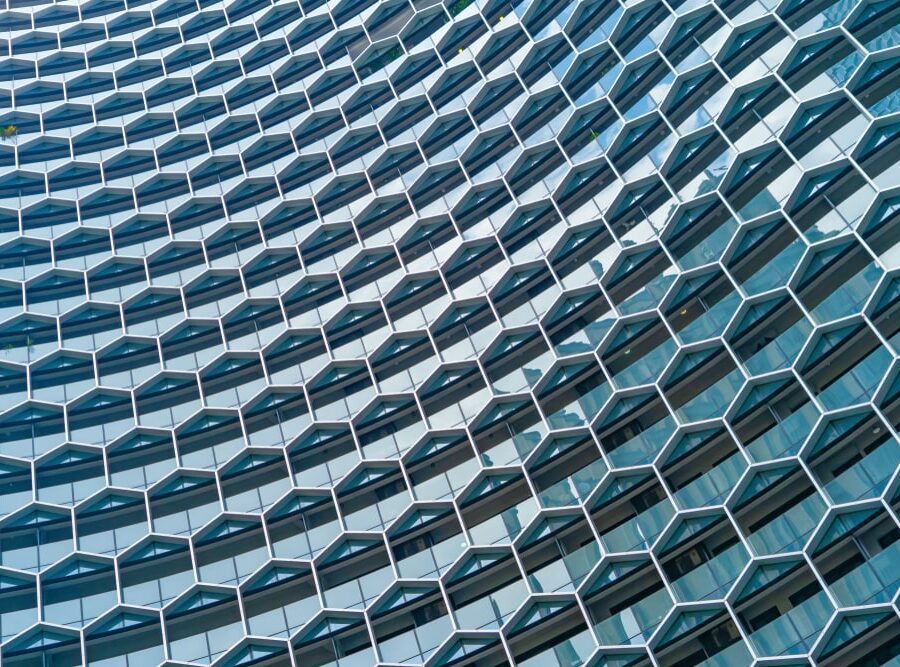 A hexagonal, glass building - Consumer Duty