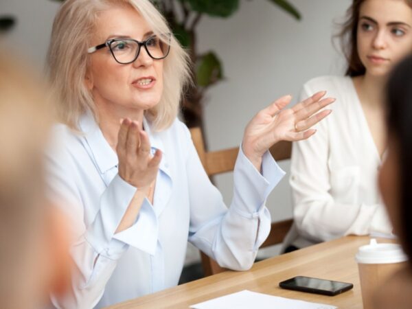A woman talking during a work meeting.