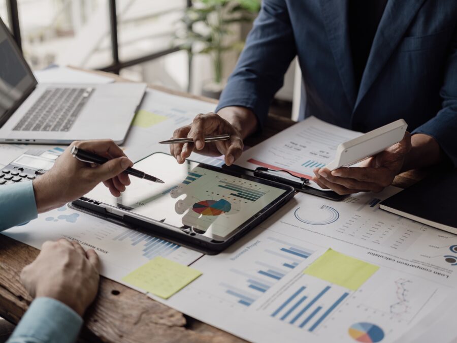 Business people looking at documents in an office.