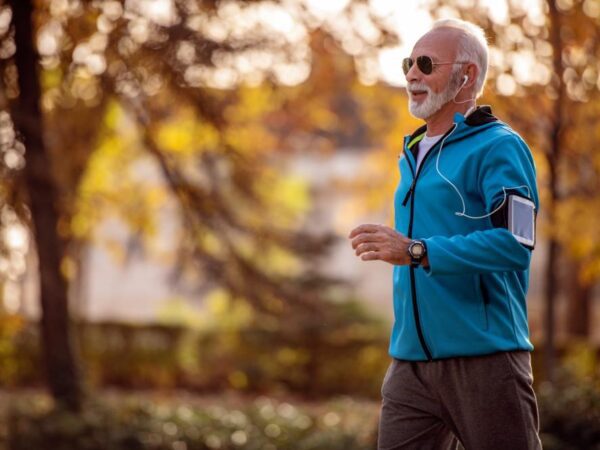 A man jogging in a park.