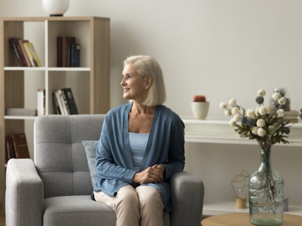 Smiling woman in an attractively furnished room