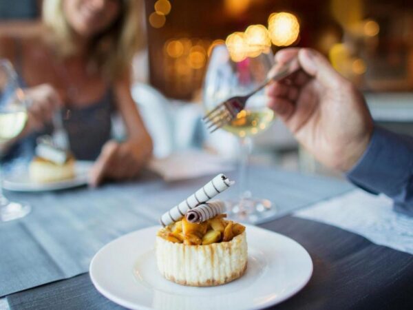 A couple enjoying a meal in a restaurant.