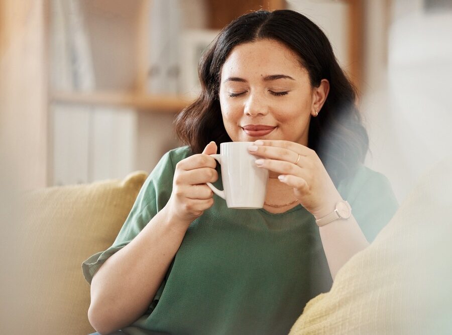 A woman enjoying a quiet cup of tea.